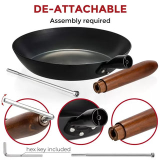 Black frying pan with detachable handle components on a white background