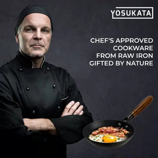 Chef holding a frying pan with food, wearing a black chef's coat against a dark background with 'YOSUKATA' branding.