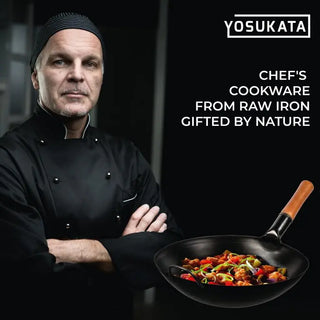 Chef in black uniform holding a wok with food, YOSUKATA branding visible