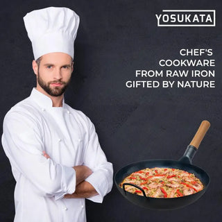 Chef in white uniform holding a frying pan with food, YOSUKATA brand visible